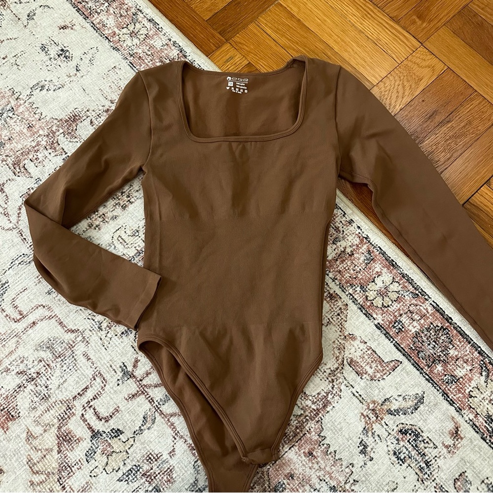 Brown body suit